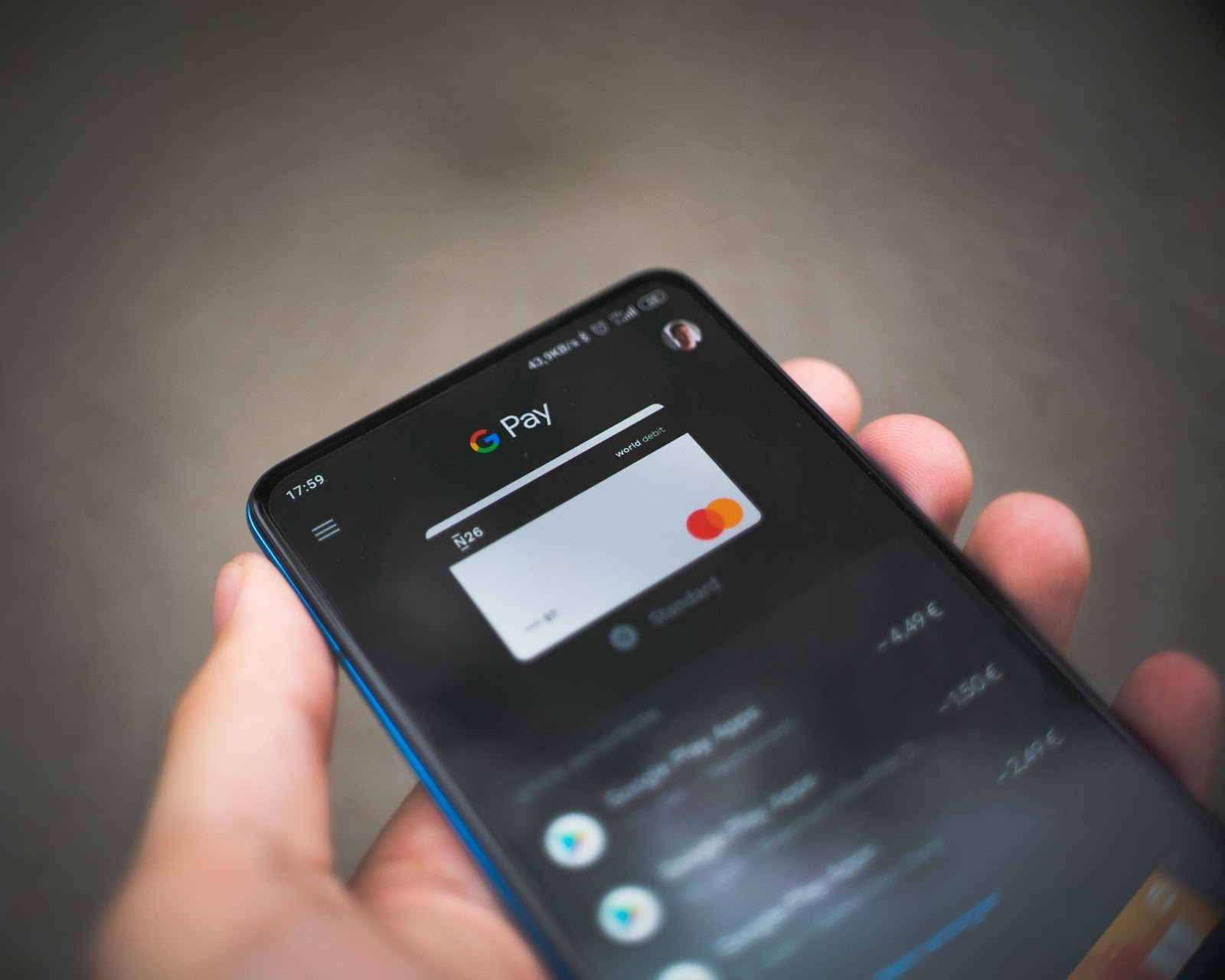Close-up photo of a phone screen displaying the Google Pay user interface