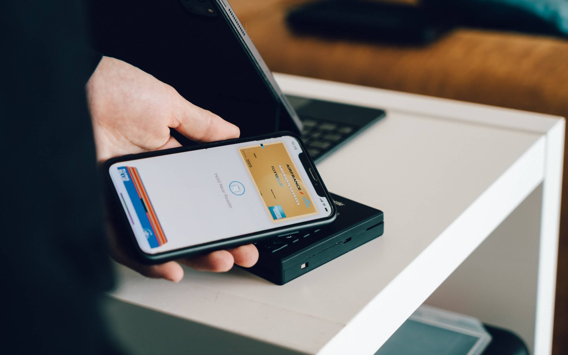 Person paying with a mobile wallet.